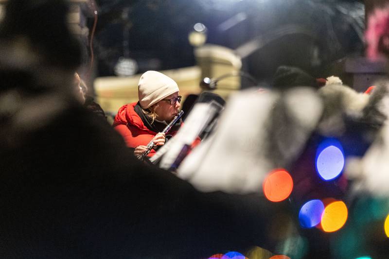 Batavia Community Band Member Jenn Nekolny performs Christmas carols during the Celebration of Lights at the Batavia Riverwalk on Sunday, Dec. 1, 2024.