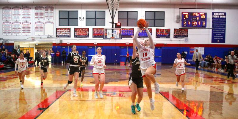 Dundee-Crown’s Kate Graham leads a fast break against Jacobs in varsity girls basketball on Friday, Dec. 12, 2025, at Dundee-Crown High School in Carpentersville.