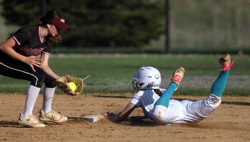 Richmond-Burton's Jocelyn Hird fields the throw as Woodstock North's Allyson Schaid slides into second base during a Kishwaukee River Conference softball game on Thursday, April 16, 2026, at Woodstock North High School.
