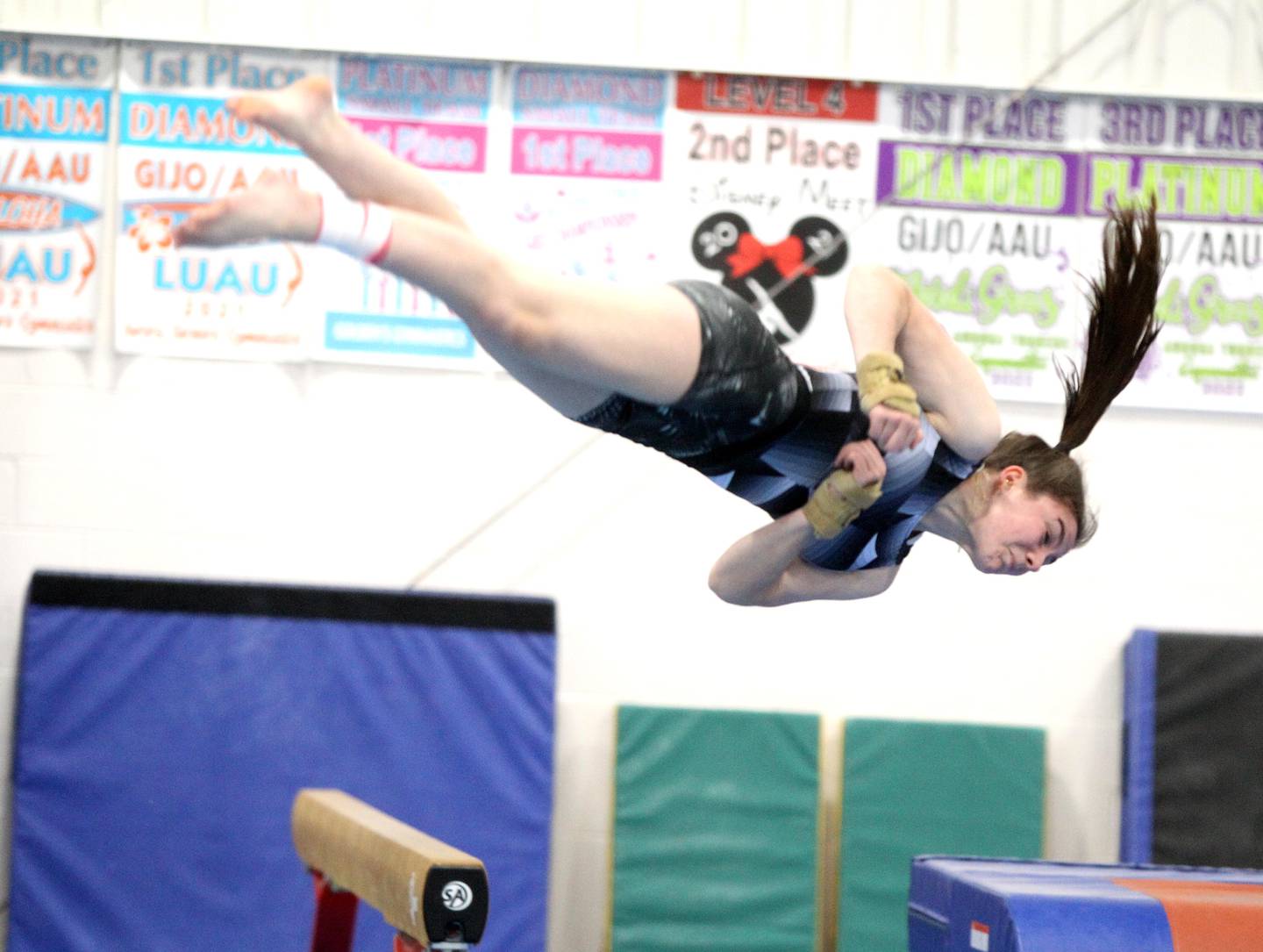 Kaneland senior gymnast Olivia Kerrins works out at the Aurora Turners gym in Aurora on Monday, Jan. 16, 2023. Kerrins has overcome multiple concussions, a severe knee injury and the onset of postural orthostatic tachycardia syndrome (POTS) during her athletic career.