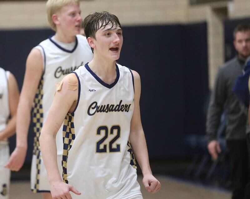Marquette's Griffin Dobberstein smiles while walking off the court after defeating Seneca on Friday, Feb. 21, 2025 in Bader Gym at Marquette Academy.