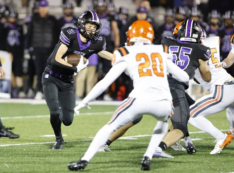 Downers Grove North's Alec Fiermunga (2) runs during the 7A first-round playoff game between Wheaton Warrenville South and Downers Grove North high schools on Friday, Nov. 1, 2024 in Downers Grove.
