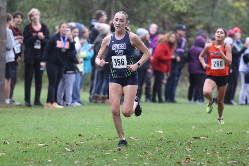 Oswego East’s Morgan Dick finishes first in the Southwest Prairie Conference meet at Channahon Park in Channahon on Friday, Oct. 13, 2023.