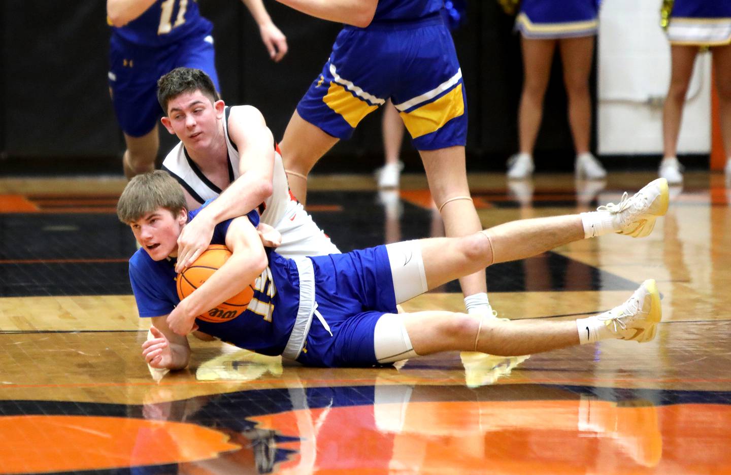 Wheaton North’s Briggs Barnick and Wheaton Warrenville South's Zach Rogers battle for possession during a game on Friday, Feb. 7, 2025 in Wheaton.