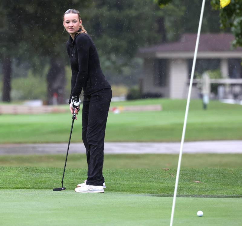 Sycamore DeKalb co-op’s Meadow Lee putts on the second green Tuesday, Sept. 24, 2024, during the Interstate 8 girls golf tournament at the Sycamore Golf Club.