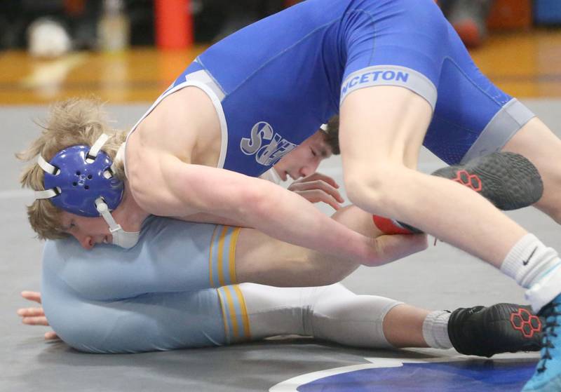 Princeton's Agustus Swanson wrestles Marquette's Connor Eggers during the Class 1A Regional meet on Saturday, Jan. 31, 2026 at Princeton High School.