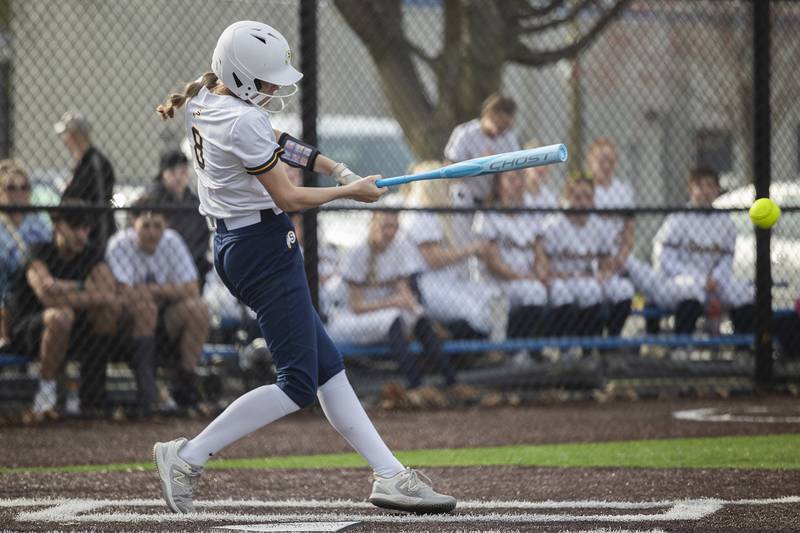 Sterling’s Marley Sechrest drives the ball to left field for the first run for the Warriors against Rockridge Wednesday, April 10, 2024 at Sterling High School.