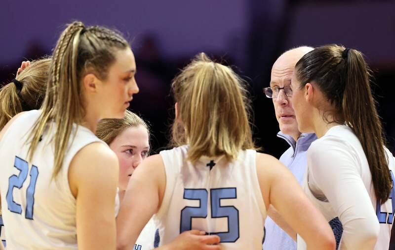 Nazareth Academy's head coach Eddie Stritzel talks to his team during a time out during the IHSA Class 3A girls basketball championship game at the CEFCU Arena on the campus of Illinois State University Saturday March 4, 2023 in Normal.