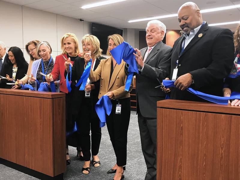 DuPage County Board members and Chief Judge Kenneth Popejoy celebrate at a ceremony Tuesday for expansions and renovations of court-related facilities. The county added two courtrooms in the courthouse, enlarged the courtroom at the jail, and added a third floor to the judicial office annex.
