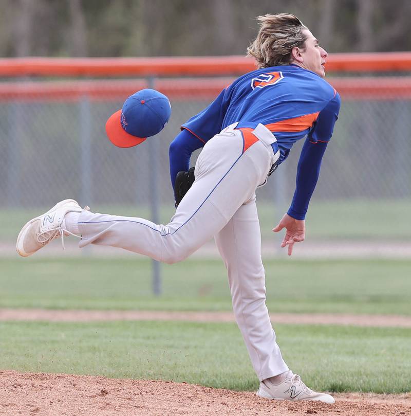 Genoa-Kingston's Aiden Awe loses his hat in the wind as he delivers a pitch during their game against Rockford Lutheran Tuesday, May 2, 2023, at Genoa-Kingston High School.