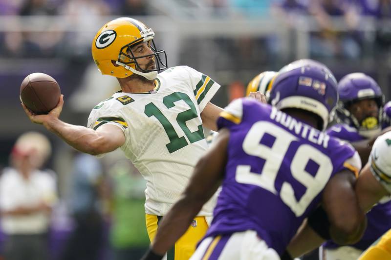 Green Bay Packers quarterback Aaron Rodgers passes during the first half against the Minnesota Vikings, Sunday, Sept. 11, 2022, in Minneapolis.
