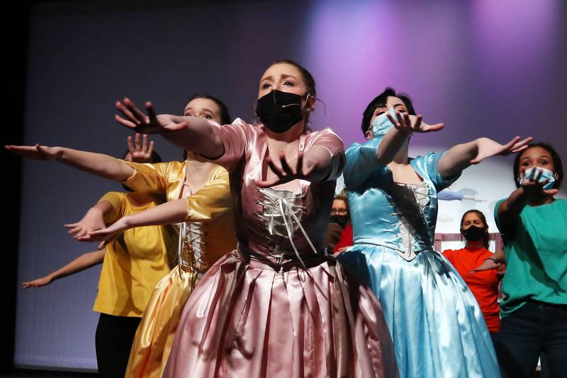 Cast members, including McKenzie Scott, front, perform the song "Schuuyler Sisters" from Hamilton during a dress rehearsal for their upcoming performance of "Musical Revue" at McHenry High School West Campus on Thursday, March 4, 2021 in McHenry.  The musical opens on Friday, March 12 at 7pm, and will have performances on Saturday, March 13 at 4:30pm and 7pm, Sunday, March 14 at 3pm, Friday, March 19 at 7pm, and Saturday, March 20 at 7pm. All performances will be in-person at the theater under reduced capacity of 50 spectators.