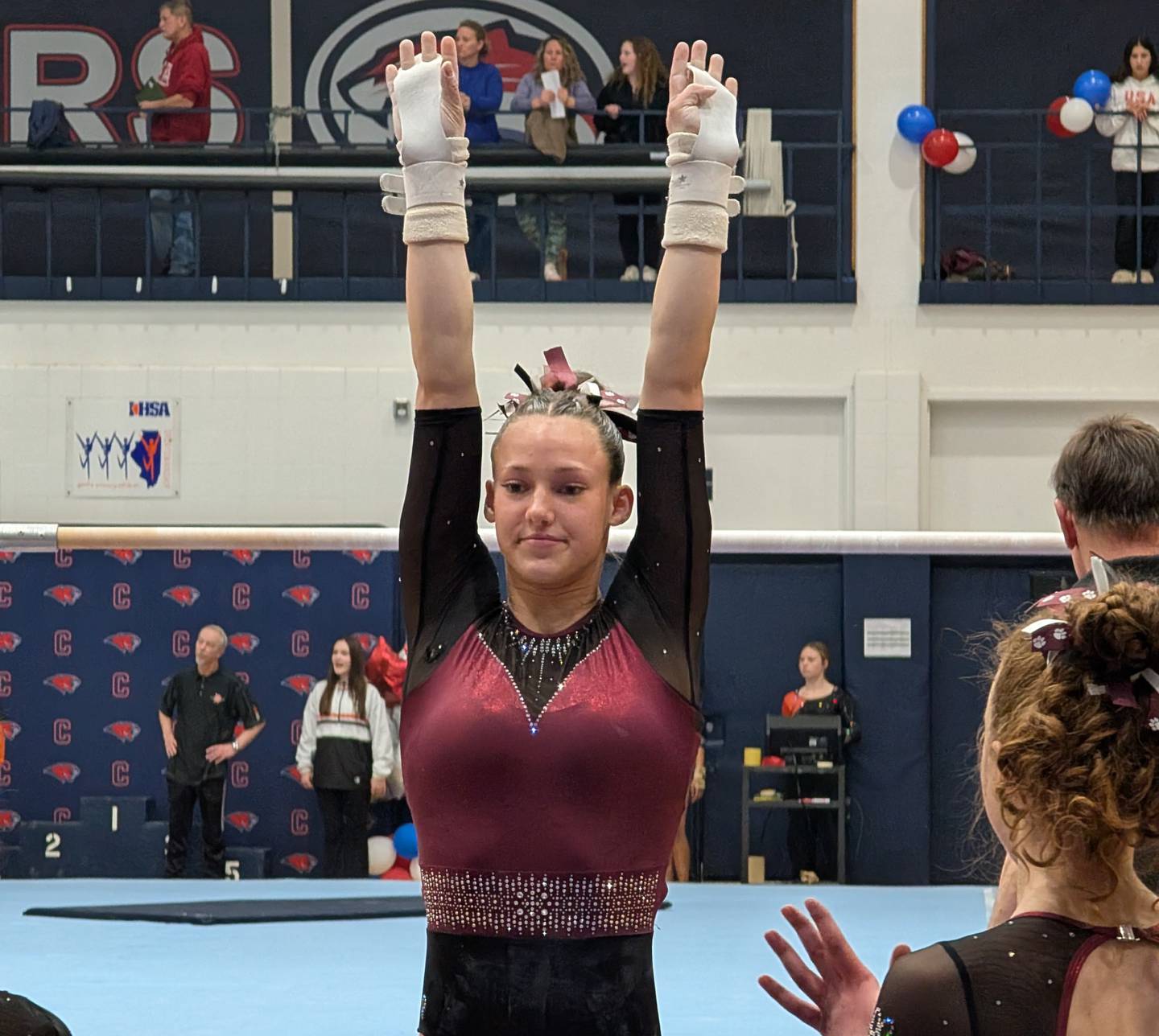 Prairie Ridge's Nora Terhaar poses after completing her dismount on the uneven parallel bars during the Conant Sectional on Monday, Feb. 9, 2006, in Hoffman Estates.