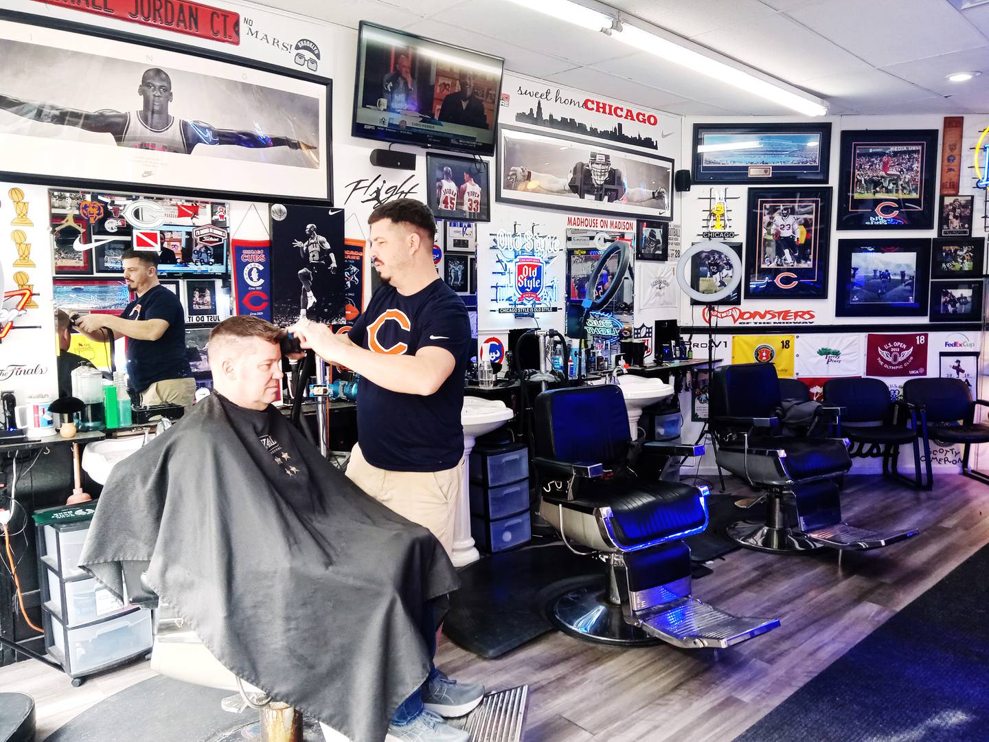 Sterling Barber Shop owner Richie Jomant cuts a customer's hair at the shop, which is observing 100 years of business in 2026.