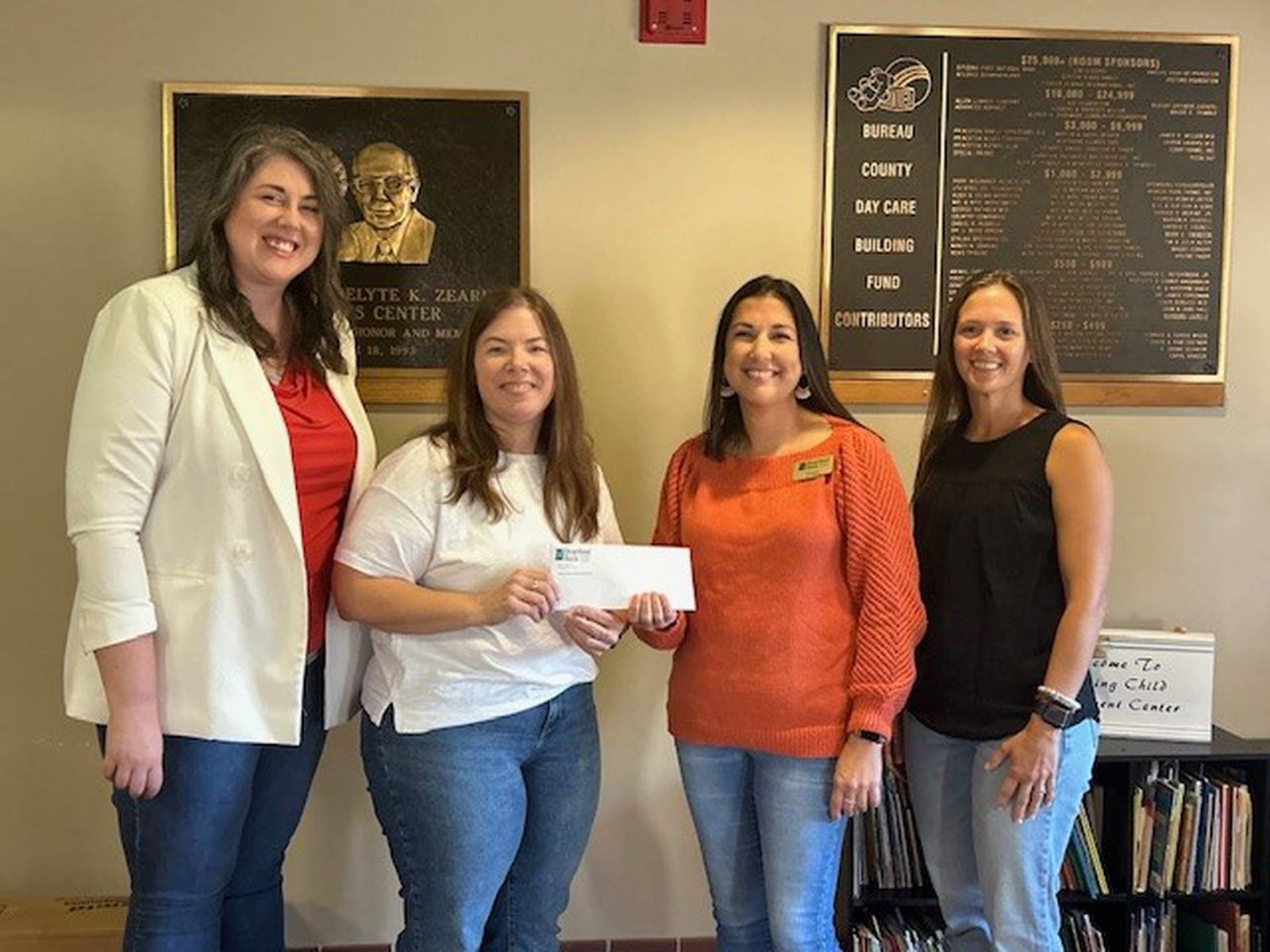 Heartland Bank donates 1,000 to Zearing Child Enrichment Center from