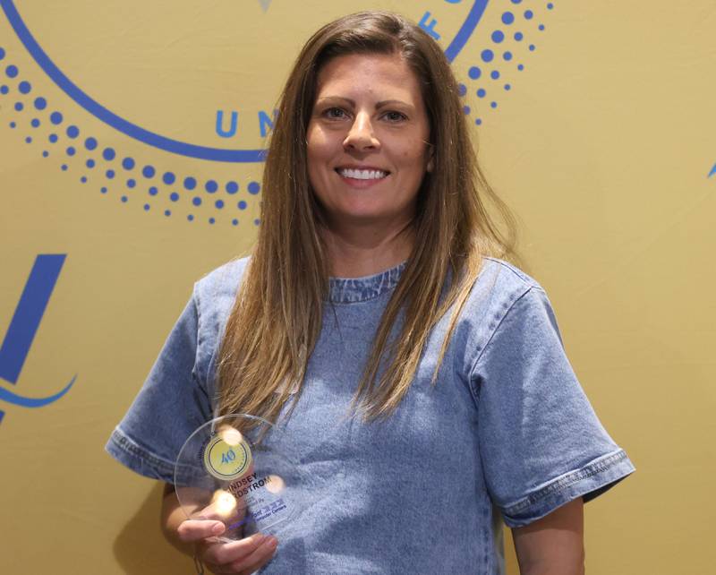 Lindsey Nordstrom poses with her 40 Under Forty award during the Illinois Valley Chamber of Commerce Champions of Change Awards Night on Wednesday, May 6, 2026 at the Westclox Event Center in Peru.