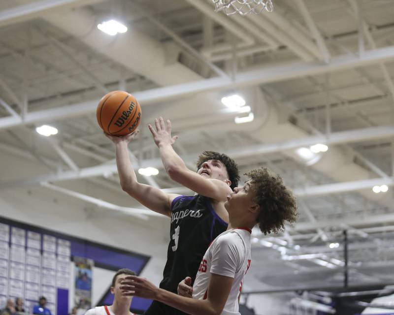 Plano's Ethan Taxis (3) puts up a shot over Streator's Christian Bruton (10) during their Plano Christmas Classic basketball game between Streator at Plano Friday, Dec 26, 2025 in Plano.