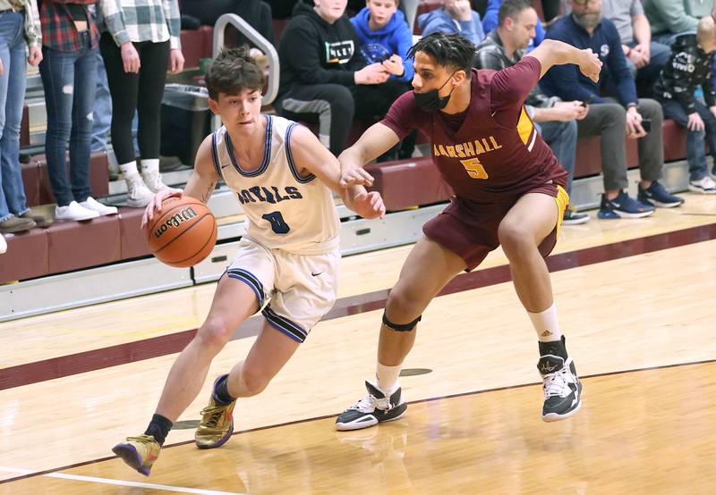 Hinckley-Big Rock's Landon Roop goes baseline against Chicago Marshall's Antonio Tyler Wednesday, March 1, 2023, during their Class 1A sectional semifinal matchup at Elgin High School.