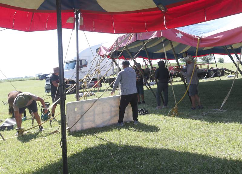 Crew members from the Culpepper & Merriweather Circus set up the "big top" tent on Monday, June 23, 2025 at Boggios in Granville.  The "big top" tent is 70 x 110 feet. It takes a crew of 12 men approximately two hours to set it up and 45 minutes to take it down. The tent weighs 3,600 pounds, stands 30 feet tall and utilizes 32 side poles, 16 quarter poles, two center poles, and 100 stakes. The circus held two shows and was sponsored by the Village of Granville and Boggio's Orchard & Produce, LLC.