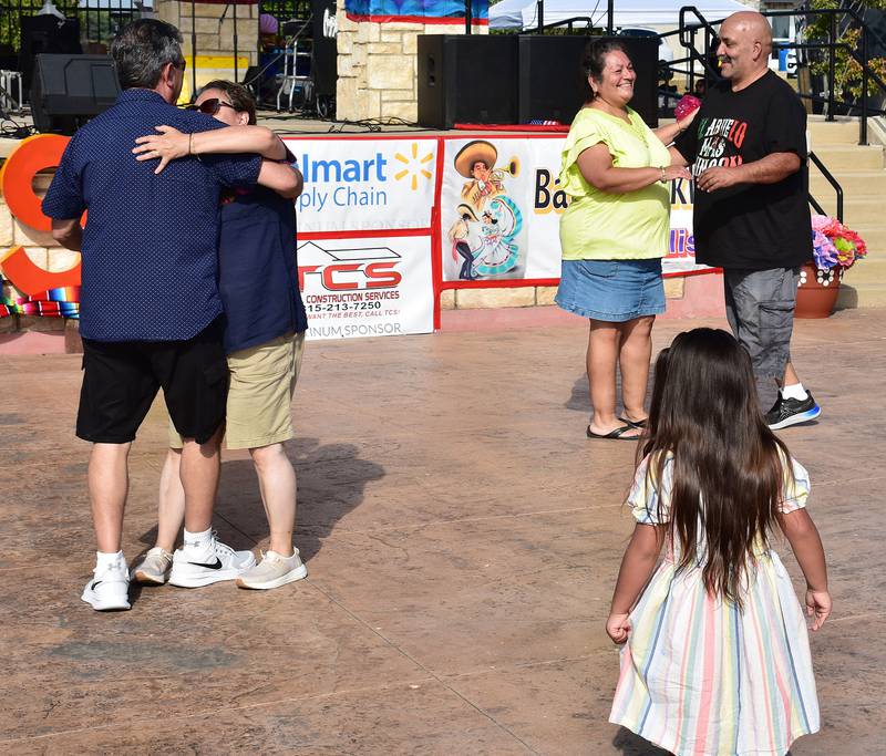 A group of people dance to live music from the band Grupo Estilo Versital at the RB&W district in Rock Falls on Saturday, Sept. 13, 2025.