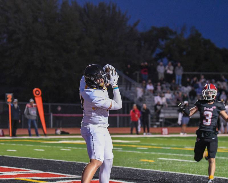 Joliet West's Sean Hogan (87) catches the ball for a touchdown on Friday Sept. 5, 2025, while traveling to take on Yorkville High School.