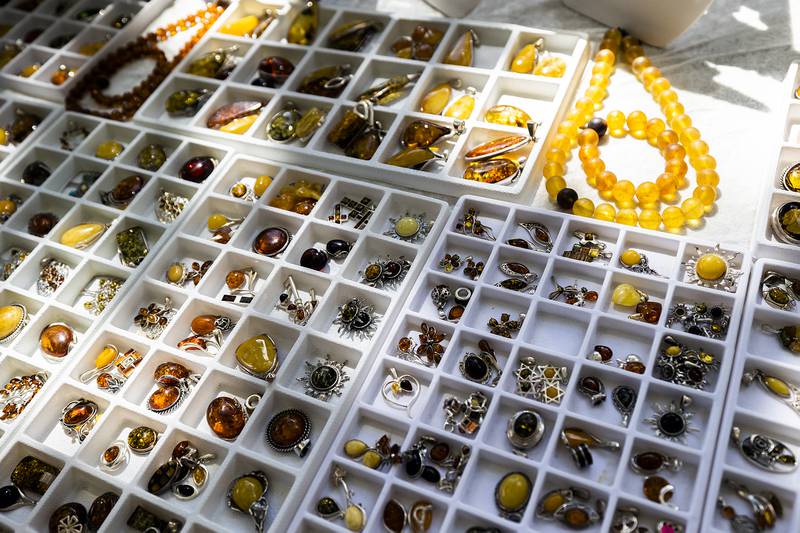Rogowski’s Baltic Amber jewelry glows in the sun Sunday, Sept. 7, 2025, at the Grand Detour Arts Festival.