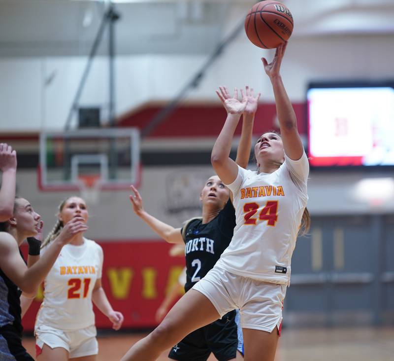 Batavia’s Hallie Crane (24) shoots the ball in the post against St. Charles North's Reagan Sipla (2) during a basketball game at Batavia High School on Tuesday, Dec 5, 2023.