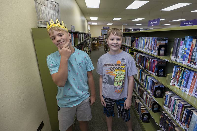 Brady Halfacre (left), 11, and Levi Drew, 12 stop for a photo Wednesday, July 3, 2024 at the Dixon library during the crafts with royalty event.