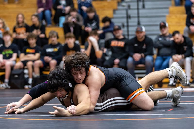 Lincoln-Way West’s Evan Gutierrez and Joliet Catholic’s Aurelio Munoz compete in the 157 pound match at Lincoln-Way West on Jan. 8, 2026.