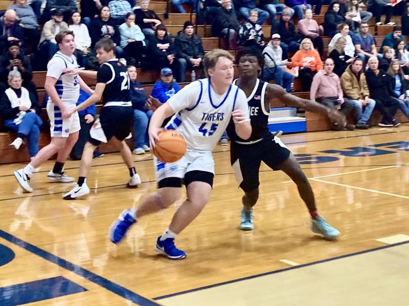 Princeton's Luke Smith drives the baseline for a late second-quarter basket to give the Tigers a 36-10 halftime lead Tuesday night over Kewanee. the Tigers won going away 60-21.