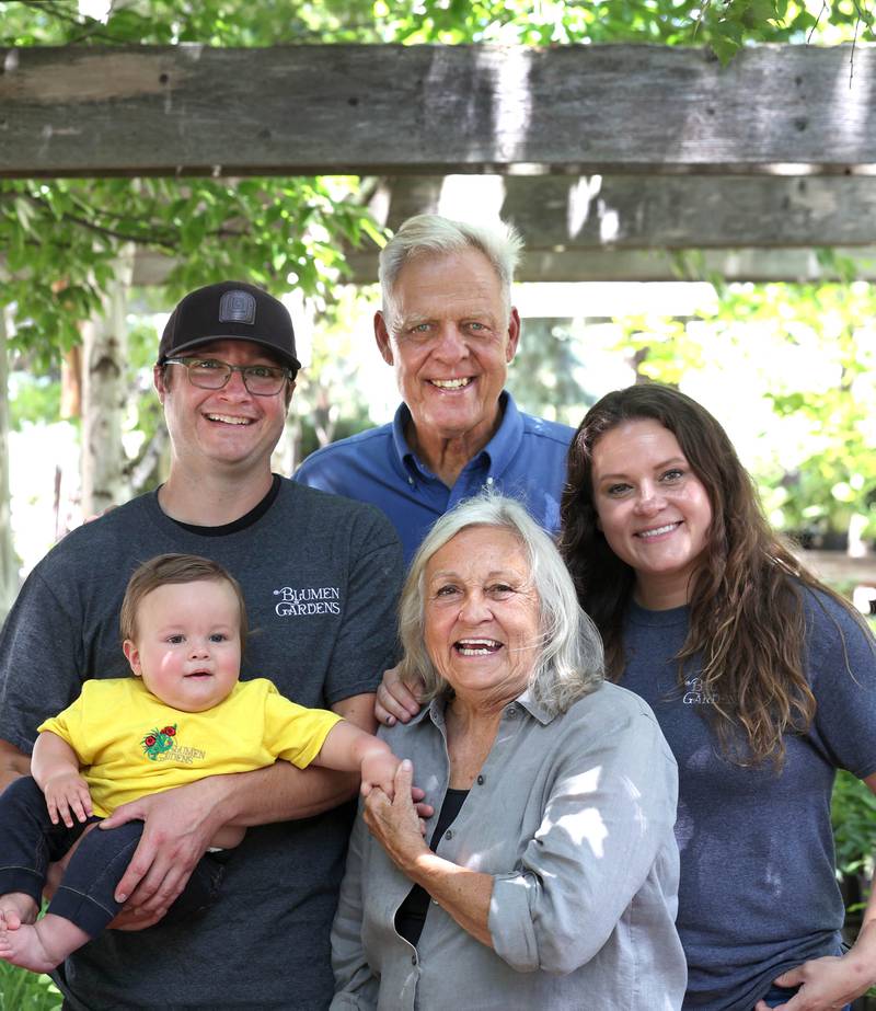 Joel Barczak (clockwise from top) co-owner of Blumen Gardens, with his daughter Jill Mandeville, co-owner, wife Joan Barczak, co-owner, grandson Clay Mandeville and son-in-law Keith Mandeville, manager, Wednesday, June 19, 2024, in the shade garden area at the store in Sycamore.