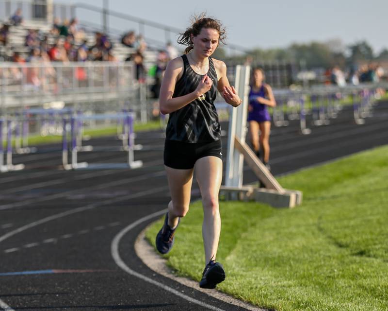 Sycamore's Lily Baker pulls away for the victory in the 3200m during the Interstate Eight conference meet at Plano High School.  May 9.2022.
