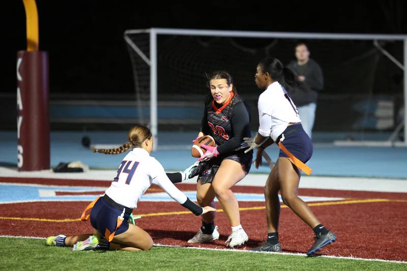 Yorkville's Kayla Kersting brings in the game-winning touchdown against Oswego defenders during the Foxes' 2-1 overtime victory over Oswego in the IHSA Kankakee Regional championship game on Thursday, Oct. 9, 2025.