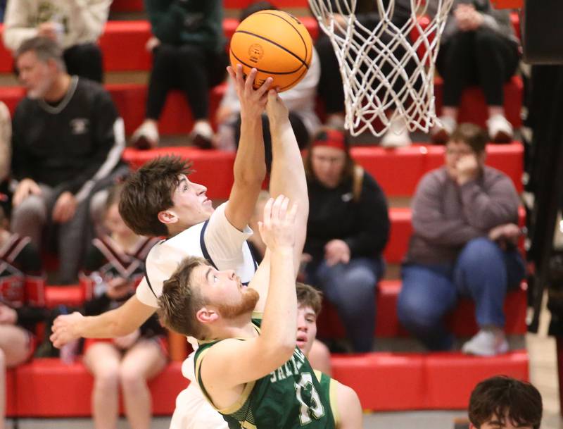 Ridgeview's Tanner Maupin grabs a rebound over St. Bede's Mason Ross during the Route 17 Classic Tournament on Wednesday, Nov. 27, 2024 at Woodland High School.