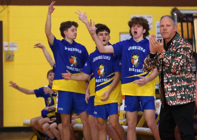 Johnsburg’s coaches and players get revved up as the Skyhawks score against Boylan in varsity boys basketball Hinkle Holiday Classic action on Tuesday, Dec. 23, 2025, at Jacobs High School in Algonquin.
