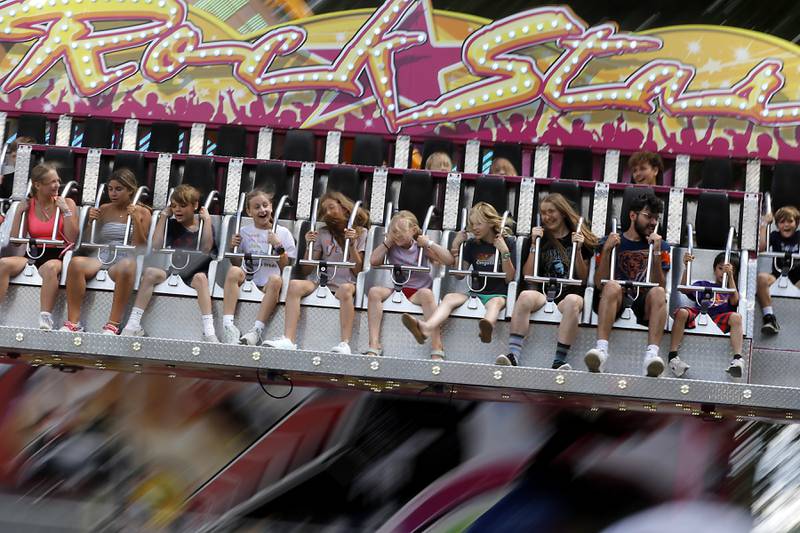 Kids react as the ride on the Rock Star ride during Lakeside Festival Friday, July 5, 2024, at the Dole.