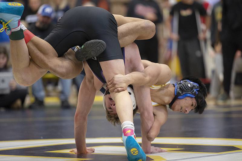 Lucas Nelson of Polo (right) takes on Dixon’s Charlie Connors in the 138-pound finals Saturday, Dec. 7, 2024, at the Carson DeJarnatt Invitational. Nelson took the win.