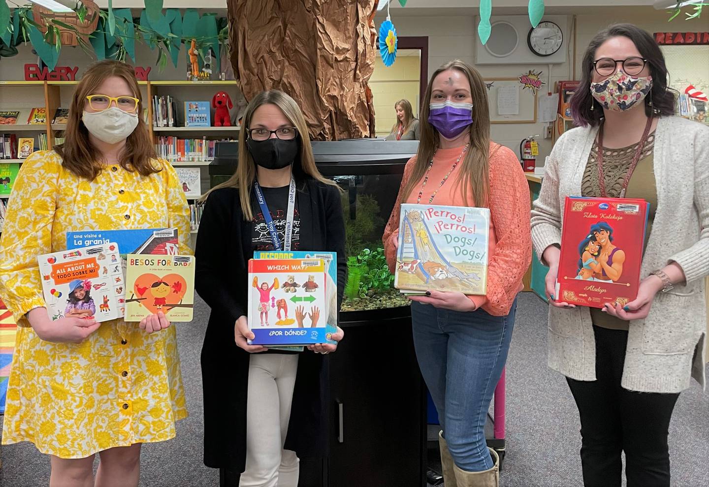 The Shorewood Troy Public Library recently donated approximately 50 non-fiction and picture books, mostly bilingual and in excellent condition, to Troy schools. Some books are monolingual Spanish, Polish and French. Pictured, from left, are Shalyn Rodriguez, assistant director and children’s services manager at Shorewood Troy Public Library; Jill Scarcelli, Troy Cronin Elementary School LRC coordinator; Nicole Davis, senior children’s assistant at Shorewood Troy Public Library; and Mara Barbel, community engagement coordinator at Shorewood Troy Public Library.