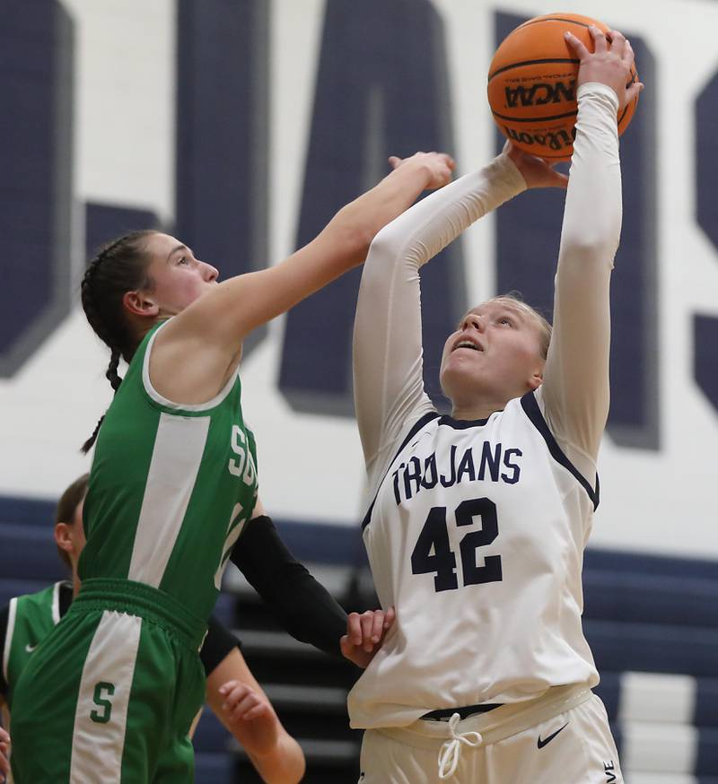 Crystal Lake South's Mallory Glover battles with Cary-Grove's Hannah McFaul for a rebound during a Fox Valley Conference girls basketball game on Tuesday, Dec. 2, 2025, at Cary-Grove High School in Cary.