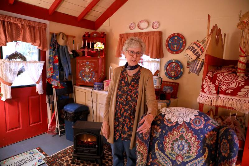 Kathy McPartland in her cottage at Good Templar Park in Geneva, where the Cottages in the Woods event will take place Oct. 21 and 22. The event will feature Swedish folk arts, gnomes and Swedish Santa.