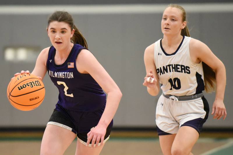Wilmington's Sami Liaromatis, left, drives down the floor as Manteno's Alyssa Singleton pursues during the IHSA Class 2A Seneca Regional championship Thursday, Feb. 19, 2026.