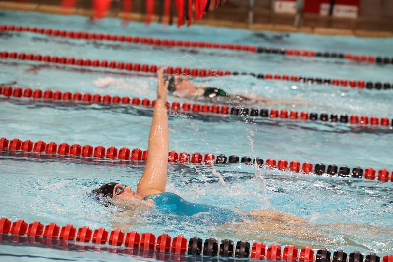 Kankakee's Aubrey Wosz competes in the 100-yard backstroke during Bradley-Bourbonnais' victory over Kankakee and Bishop McNamara in the All-City swim meet on Tuesday, Sept. 9, 2025.