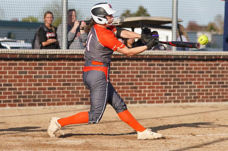 Minooka’s Karli McMillin (11) slaps a single against Oswego during a Southwest Prairie Conference softball game at Oswego High School on Wednesday, April 23, 2025.