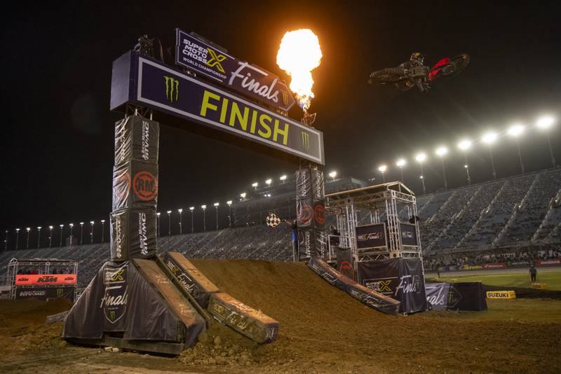 Pyrotechnics erupt as Hunter Lawrence takes the checked flag and the 250cc overall event win at the Super Motocross Finals at Chicagoland Speedway on September 16, 2023.