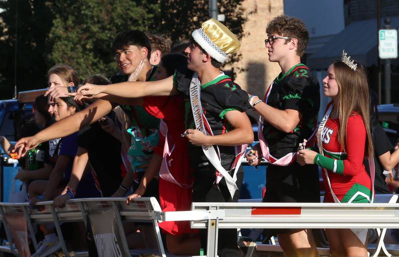 L-P seniors (from left) Andres Medina,  Homecoming king Peyton Cumming, Josh Bickford, and Homecoming queen Sophie Ploch ride the L-P Homecoming float in the parade on Thursday, Sept. 26, 2024 downtown La Salle.