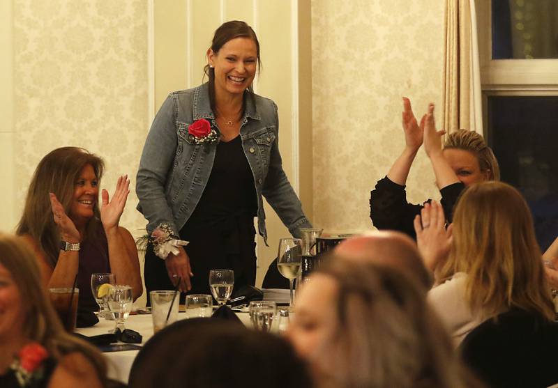 People clap for Brynn Dixon from District 47 after she won the service personnel award during the the Educator of the Year Dinner, Saturday, May 6, 2023, at Hickory Hall, in Crystal Lake. The annual awards recognize McHenry County’s top teachers, administrators and support staff.