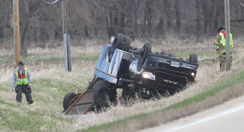 Utica firefighters work the scene of a single vehicle rollover just to the west of the entrance of the Starved Rock Lock and Dam Visitors Center on Dee Bennett Road on Monday, April 7, 2025 near Utica. La Salle County Sheriff, Utica Police, Fire and EMS all responded to the scene. The crash happened shortly before 1p.m. The driver was uninjured.