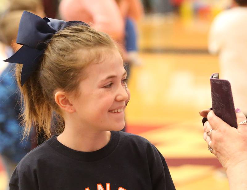 Paisley Kasperski of Dalzell, smiles while having her face painted during the Spring Valley Easter egg hunt presented by Upscale Resale and Grow on Saturday, March 23, 2024 at Hall High School.