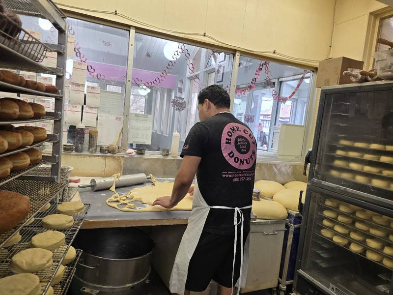 An employee at Home Cut Donuts in Joliet rolls and cuts dough for Paczki, a traditional jelly-filled, doughnut-like pastry, which many people enjoy before the start of the Christian Lent, on Saturday, Feb. 14, 2026.