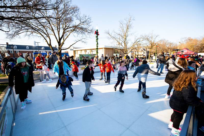 Christmas in the Square attendees skate on the artificial ice rink in Lockport on Saturday, Nov. 25, 2023.